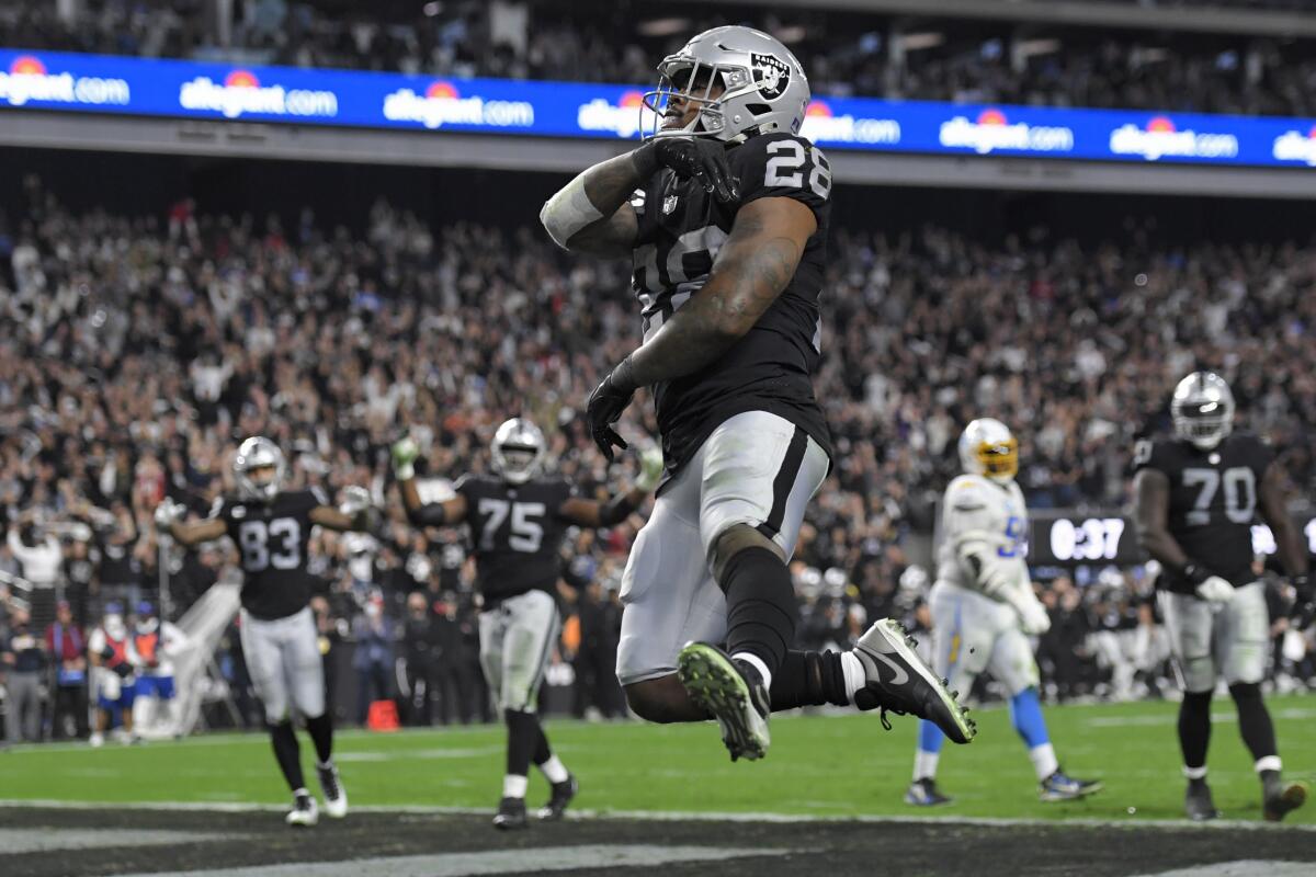Las Vegas Raiders running back Josh Jacobs celebrates after scoring a touchdown against the Chargers.