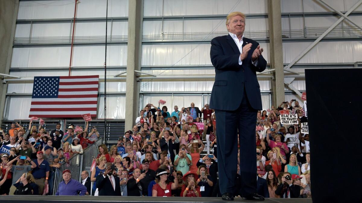 President Trump holds a rally at the Orlando-Melbourne airport in Melbourne, Fla., on Saturday.