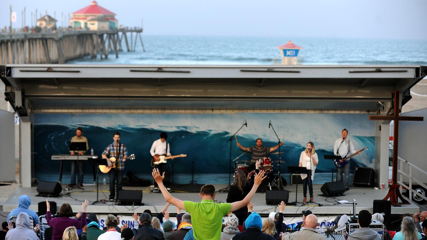 Worshipers gather for a nondenominational, community Easter sunrise service at Huntington Beach Pier Plaza on April 5, presented by Hope Chapel.