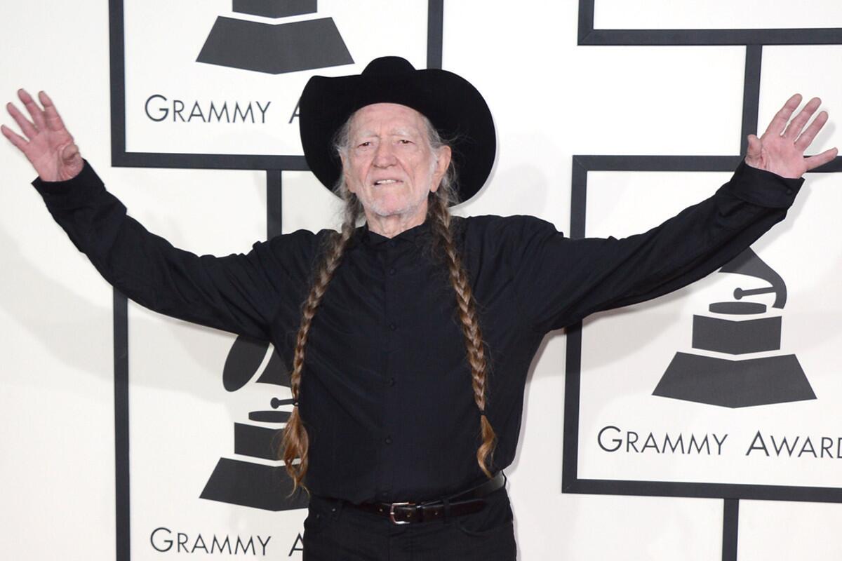 Willie Nelson arrives at the 56th annual Grammy Awards at Staples Center in L.A. on Sunday. He, Merle Haggard and Kris Kristofferson will perform together during the show.