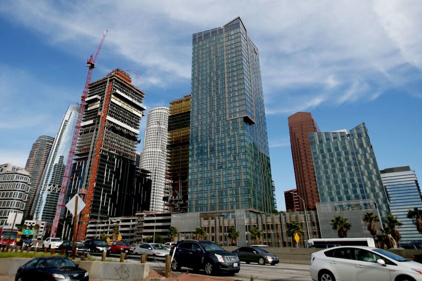 LOS ANGELES, CALIF. - MAR. 2, 2017. Greenland, a Shanghai-based company, is constructing a large high-rise residential complex along the Harbor Freeway at 8th Street in downtown Los Angeles. (Luis Sinco/Los Angeles Times)