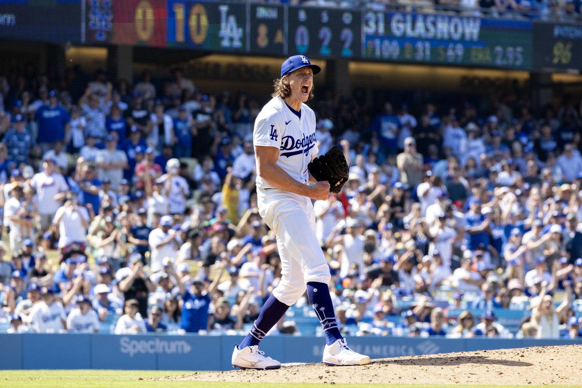 Dodgers starting pitcher Tyler Glasnow celebrates after striking out a batter with the bases loaded in the eighth inning.