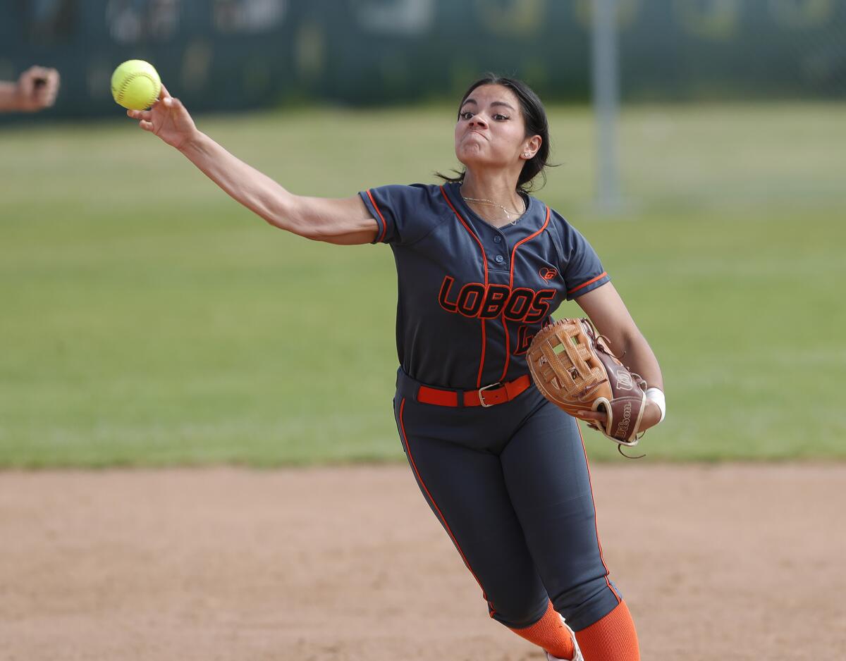 Los Amigos shortstop Valerie Villa (48) throws the runner out at first against Loara on Friday.