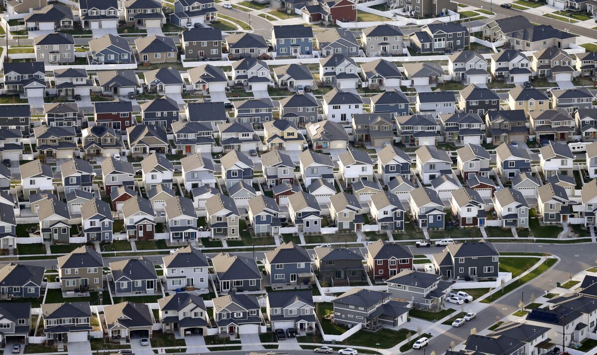 This April 13, 2019, file photo, shows rows of homes, in suburban Salt Lake City.  