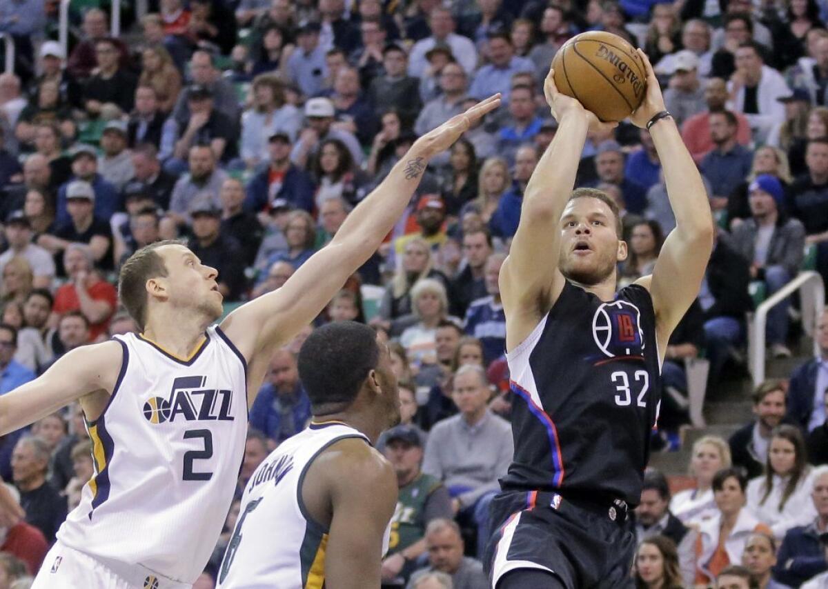Clippers forward Blake Griffin (32) shoots as Utah Jazz forward Joe Ingles (2) defends in the first half on Feb. 13.