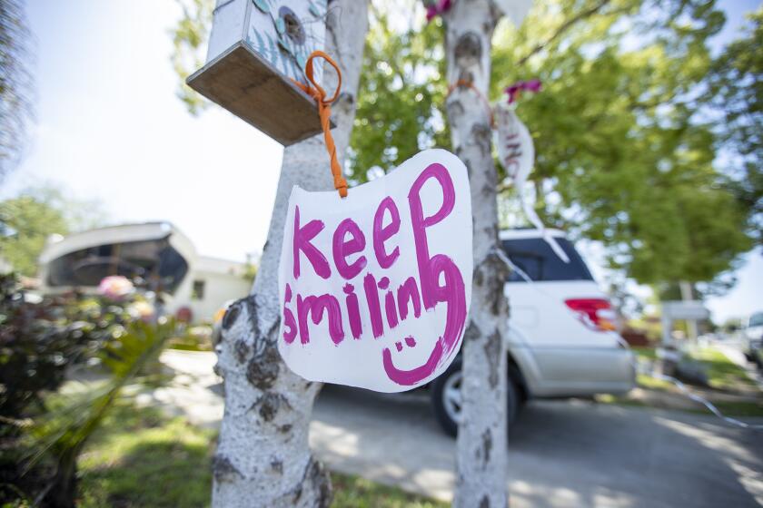 The Positive Tree on Congress Street in Costa Mesa in the Canyon Park neighborhood has encouraging messages for people walking and driving through the neighborhood on Friday, April 3.