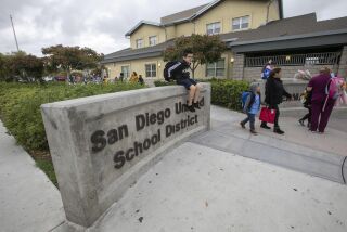 Students are picked up as school lets out at Sherman Elementary school in Sherman Heights, just east of downtown San Diego, on March 13, 2020. Earlier in the day it was announced that school will be cancelled starting Monday because of the COVID-19 virus.