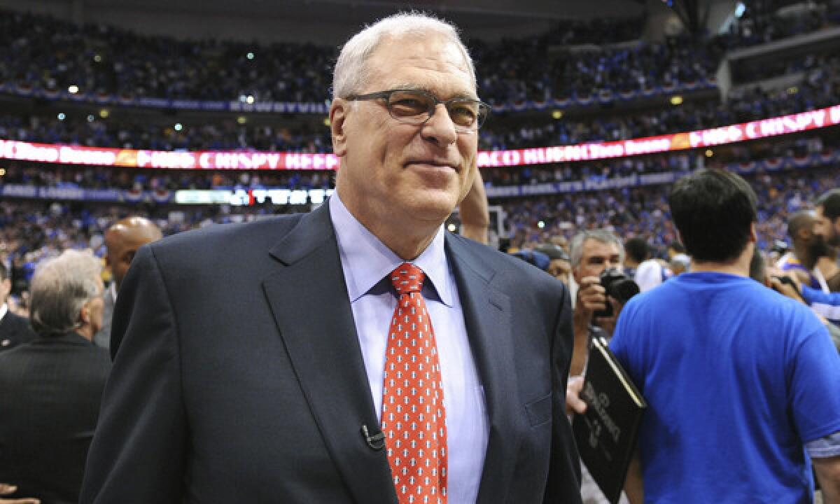 Phil Jackson walks off the court following his final game as Lakers coach in May 2011. Are the Lakers really going to let Jackson go to the New York Knicks?