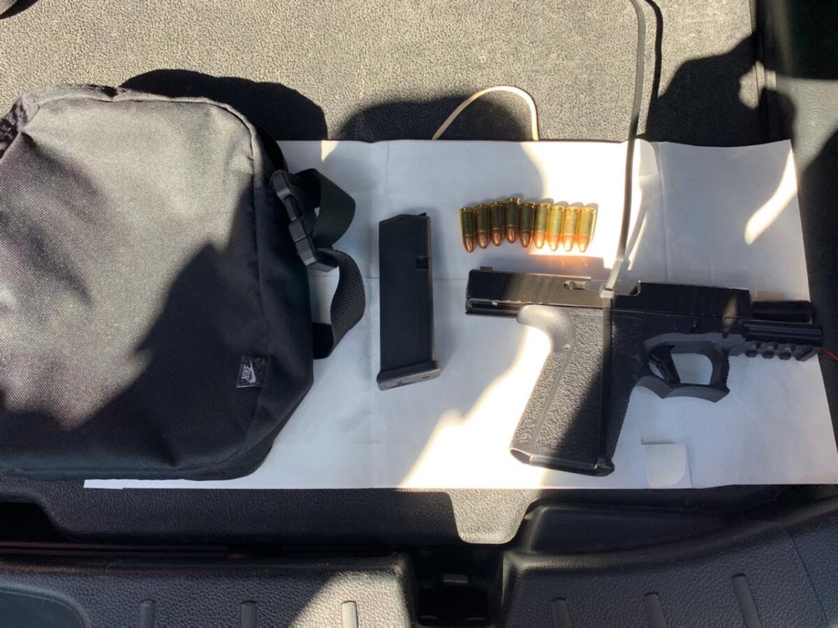 A bag, handgun, magazine and nine bullets