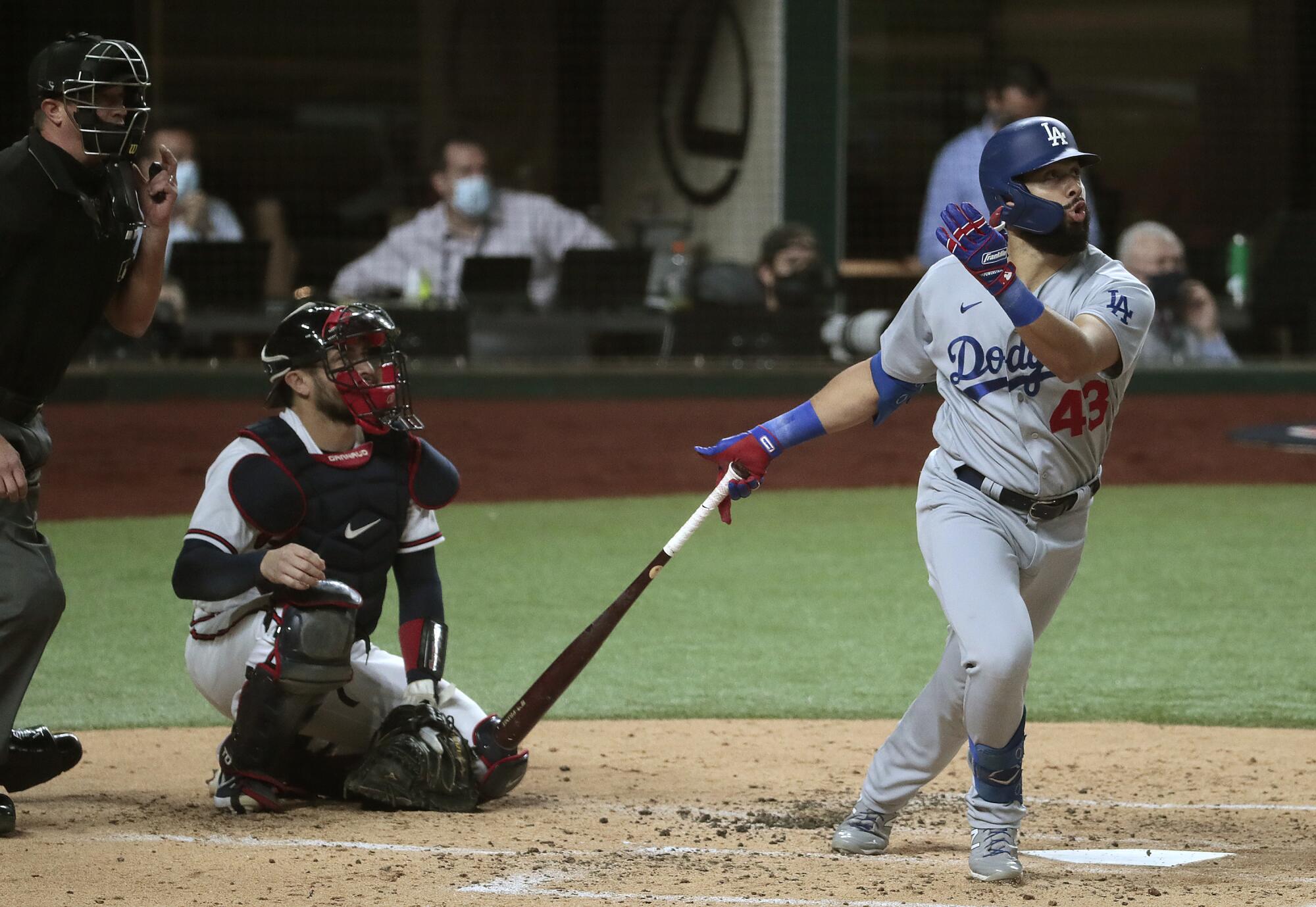Dodgers designated hitter Edwin Ríos hits a home run during the third inning of Game 4 of the NLCS.