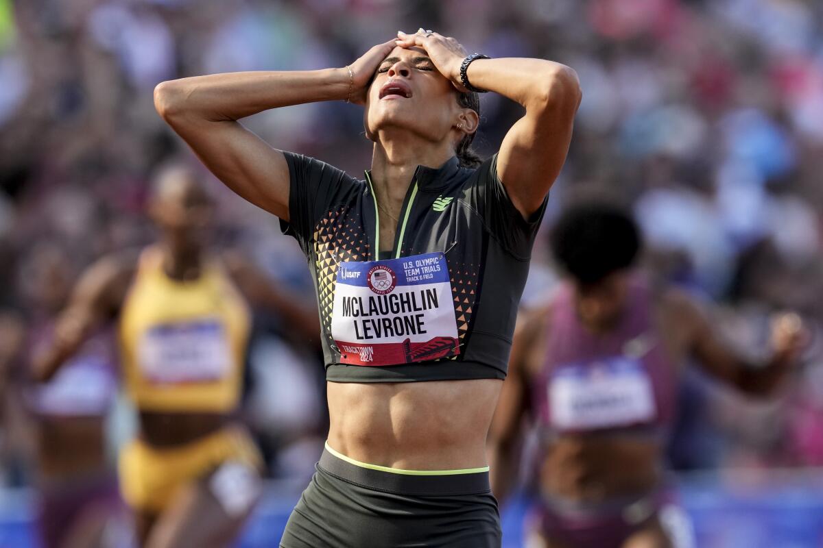Sydney McLaughlin-Levrone reacts after crossing the finish line to win the women's 400-meter hurdles.