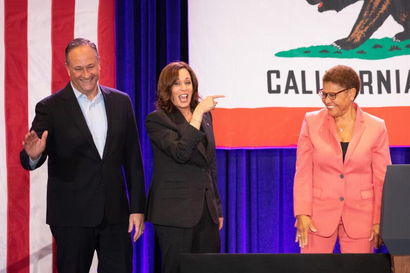 WESTWOOD, CA - NOVEMBER 07: Second Gentleman Douglas Emhoff and Vice President Kamala Harris celebrate with Los Angeles mayoral candidate Karen Bass during a rally at the UCLA Meyer and Renee Luskin Conference Center on Monday, Nov. 7, 2022 in Westwood, CA. (Myung J. Chun / Los Angeles Times)