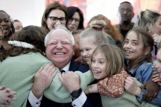 MINNEAPOLIS, MN. - MARCH 2023: Minnesota DFL (Democratic-Farmer-Labor Party) Governor Tim Walz gets a huge hug from students at Webster Elementary in Minneapolis, Minn., after he signed into law a bill that guarantees free school meals, (breakfast and lunch) for every student in Minnesota's public and charter schools on Friday, March 17, 2023. (Photo by Elizabeth Flores/Star Tribune via Getty Images)