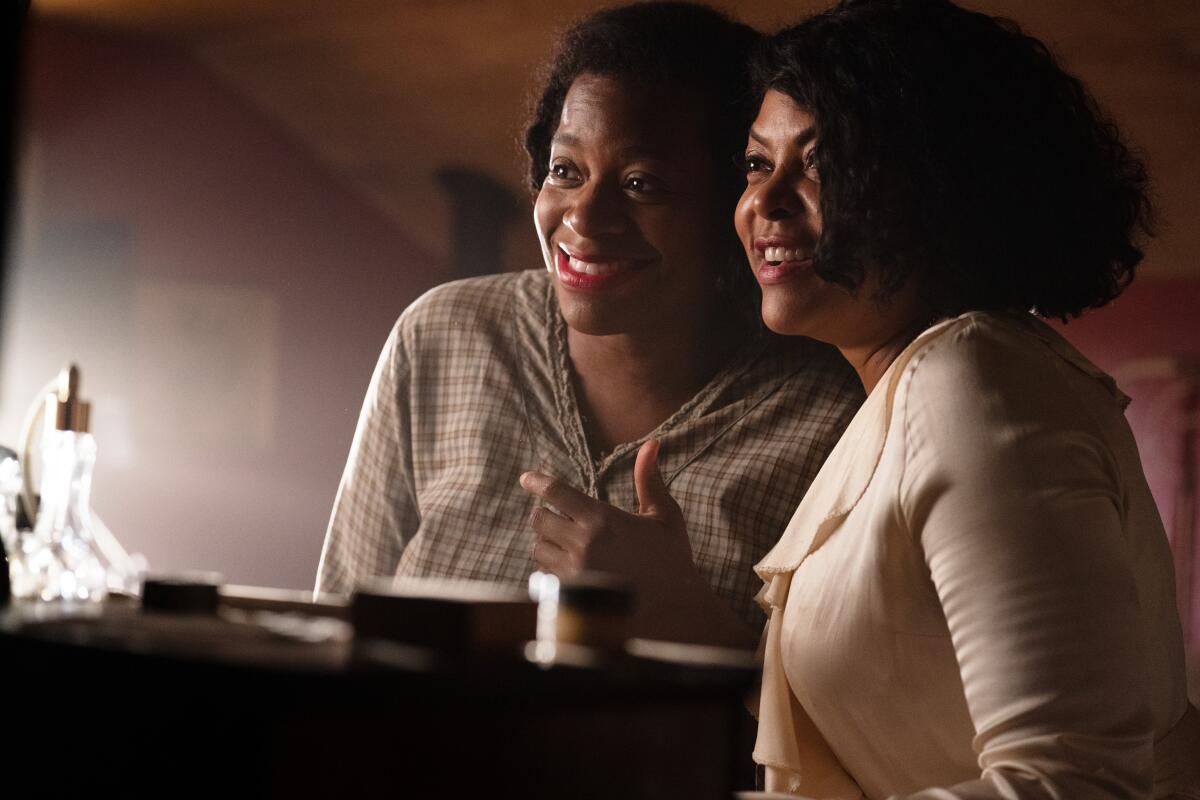 Fantasia Barrino and Taraji P. Henson smile in "The Color Purple." 