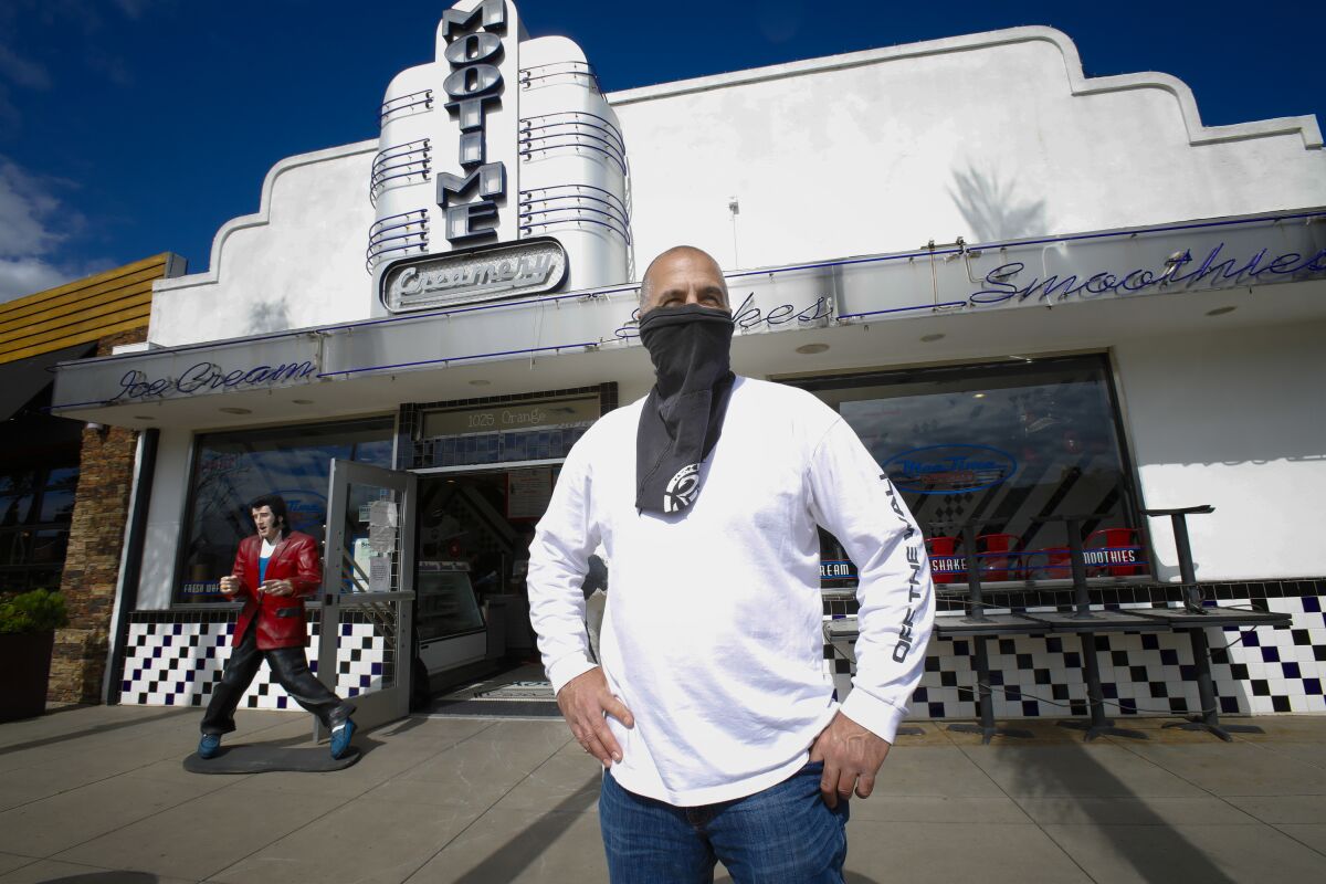 David Spatafore, principal at Blue Ridge Hospitality stands in front of Moo Time Cookies & Creamery in Coronado on Friday April 17, 2020. Moo Time Cookies & Creamery is among his 13 different eatery and restaurants he owns. Since the Coronavirus pandemic, Spatafore was forced to close 9 of his restaurants and lay off 270 of his employees. Shifted some staff to the remaining 4 location that remain open, Spatafore was able to keep 28 employees.