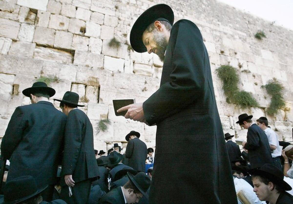 Jews pray during rituals at the Western Wall.