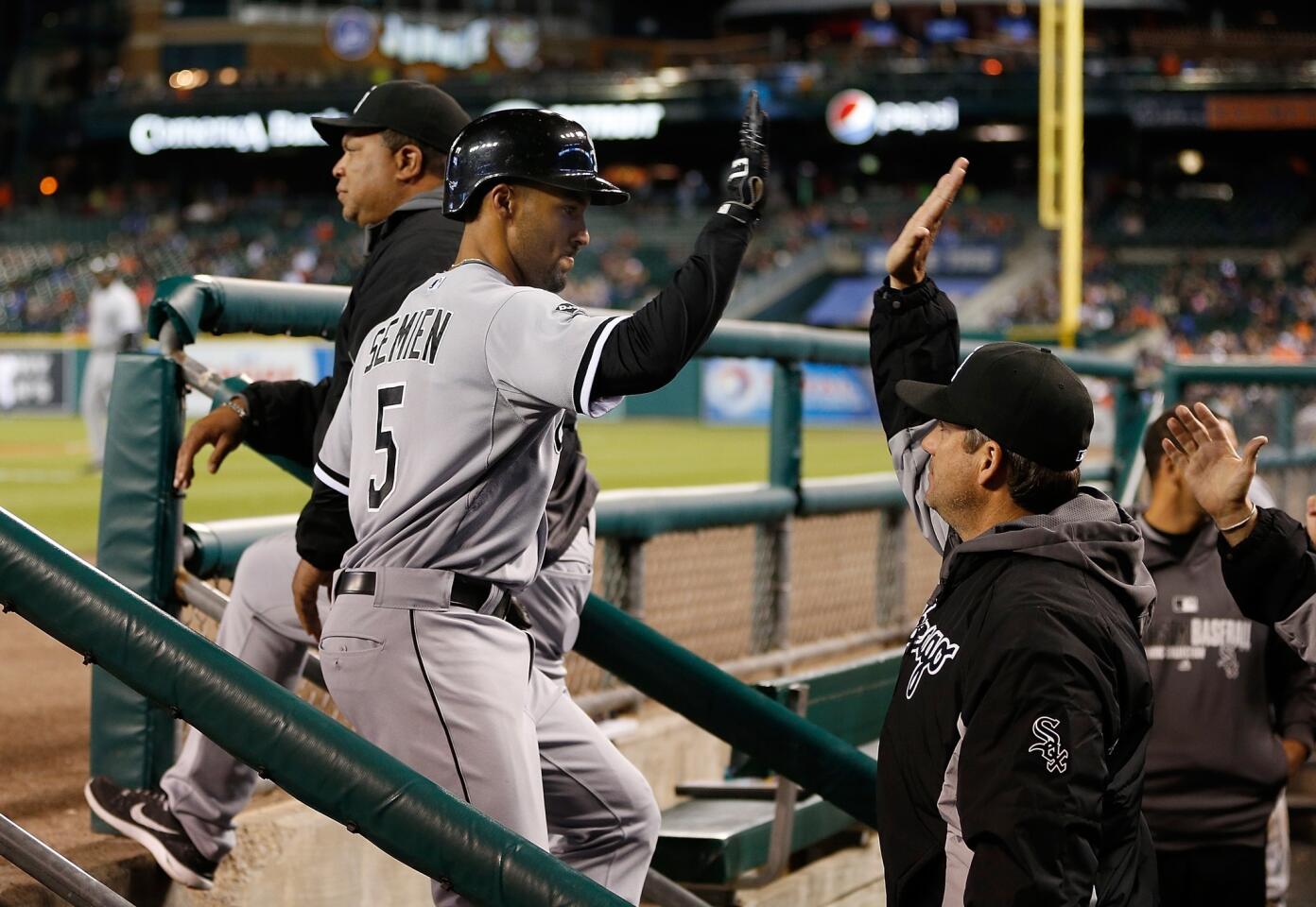 Marcus Semien celebrates his seventh inning grand slam with manager Robin Ventura.