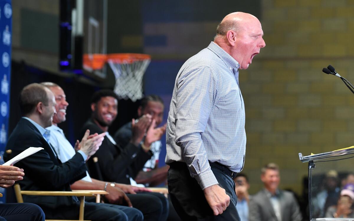 Clippers owner Steve Ballmer lets out a yell as he takes the stage during the introductory news conference for Kawhi Leonard and Paul George.