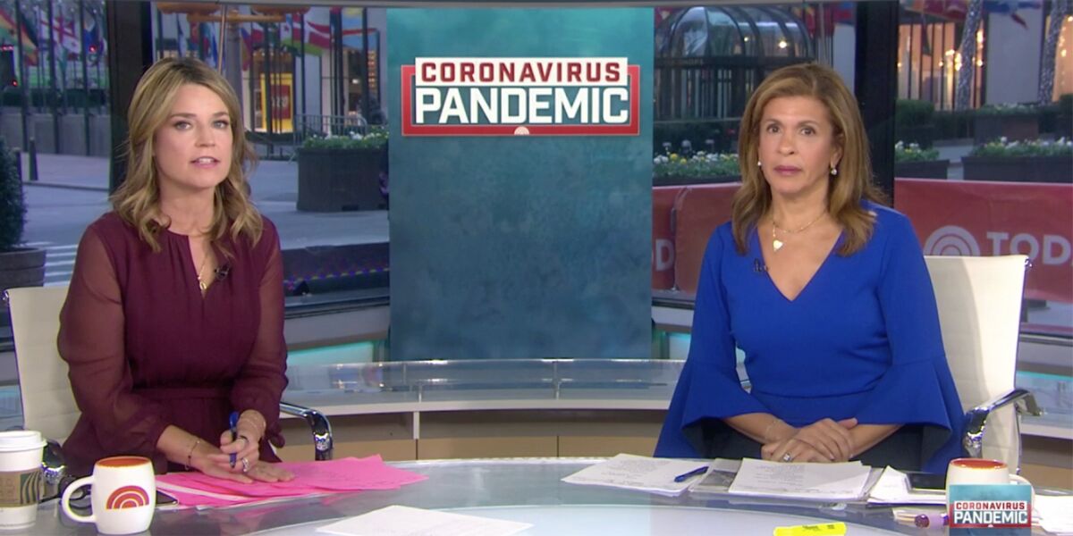 Two news anchors in front of a graphic that reads "Coronavirus pandemic"