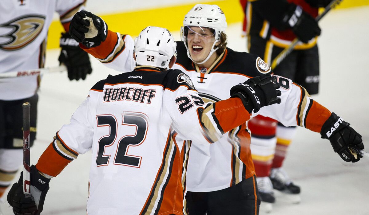 Anaheim Ducks' Shawn Horcoff, left, celebrates his goal with teammate Rickard Rakell during the second period against the Calgary Flames on Tuesday.