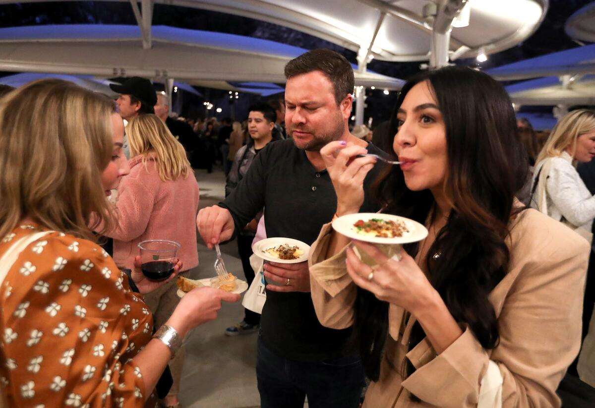 Guests enjoy small plates from the Wine Gallery during the Taste of Laguna Food and Music Festival on Thursday.