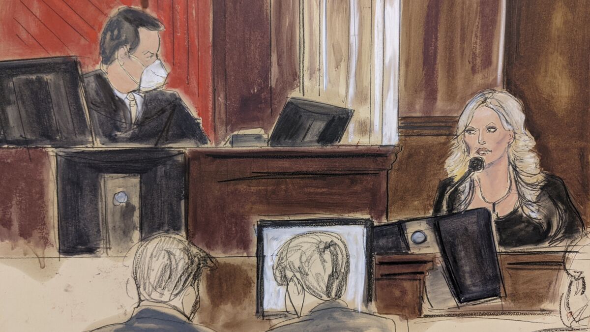 This courtroom sketch shows presiding Judge Jesse Furman, left, listening as Stormy Daniels testifies