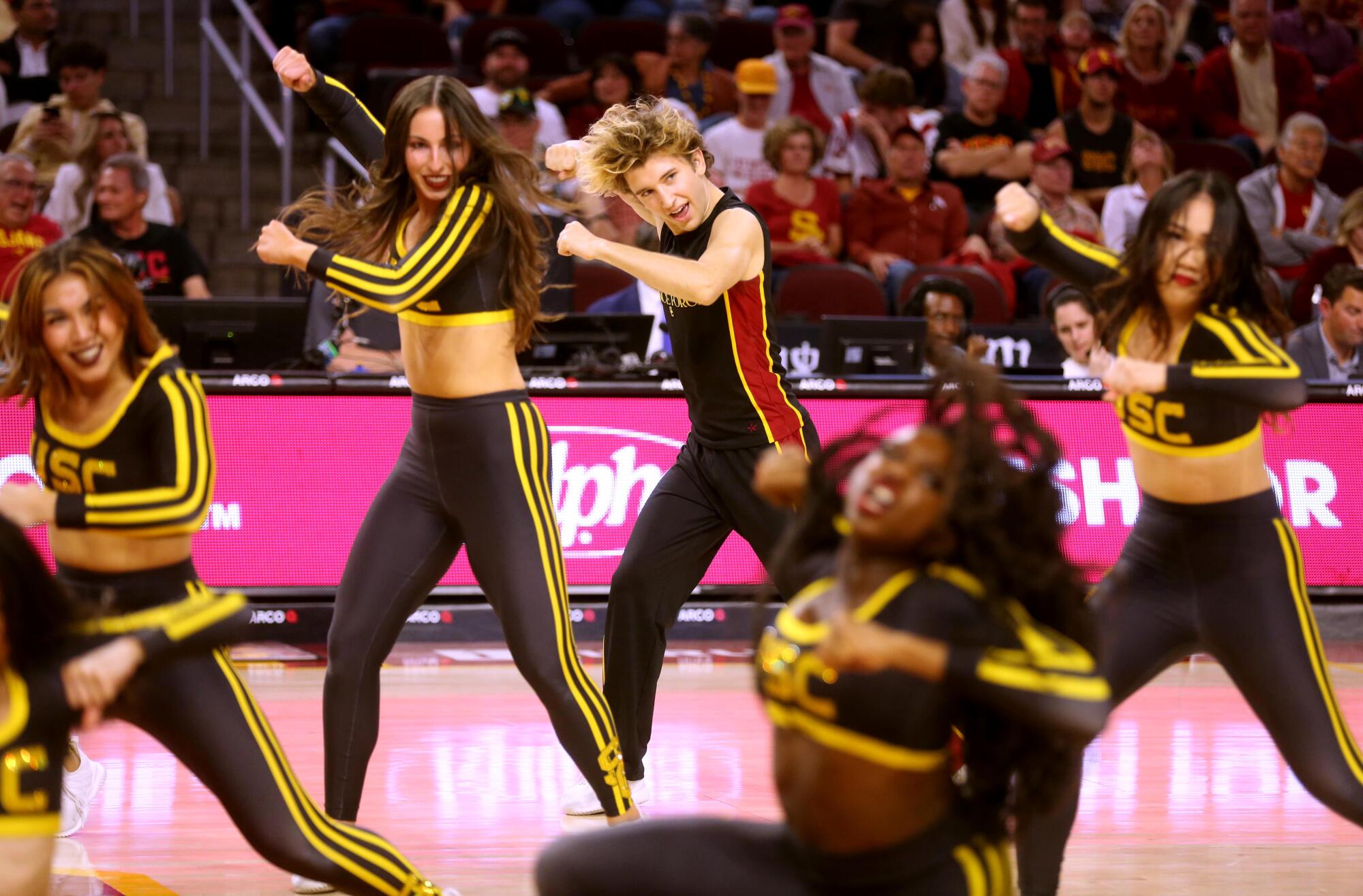 Hugo Miller, center, performs with USC's Trojan Dance Force at Galen Center.