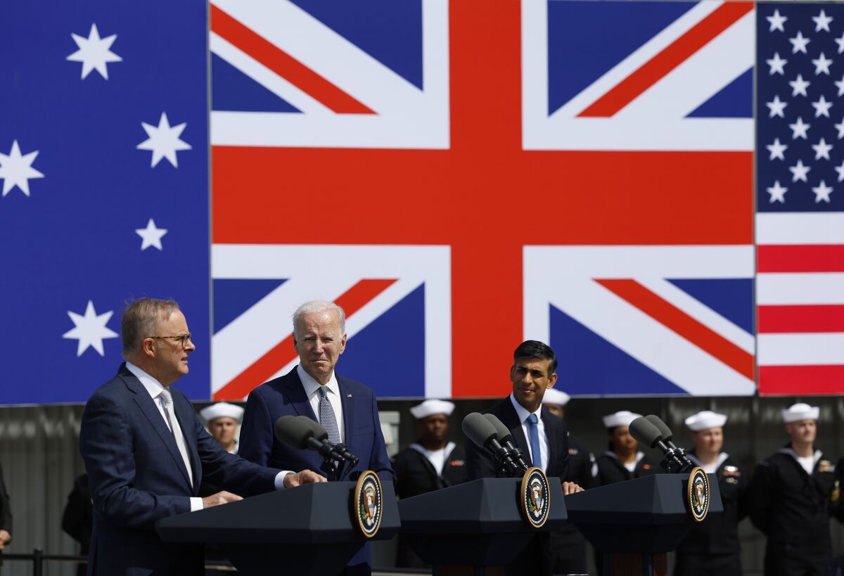 President Biden, center, looks on as Australian Prime Minister Anthony Albanese, left, speaks.