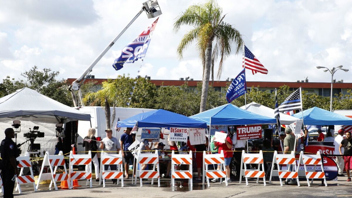 Protesters gather outside the Broward County Supervisor of Elections offices on Sunday.