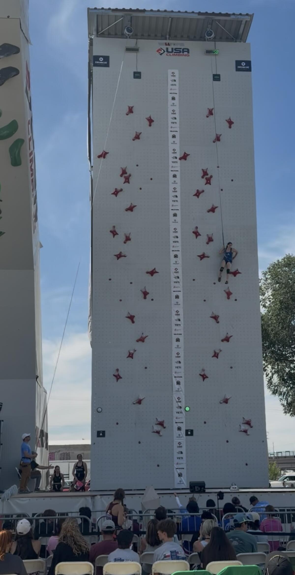 Woodbridge senior Maddi Haferling scales a tower during a speed climbing competition.