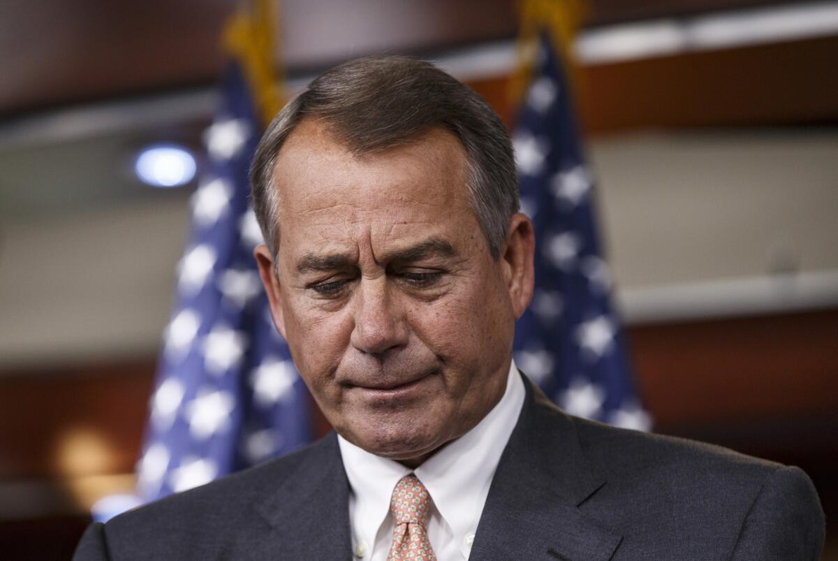 House Speaker John A. Boehner (R-Ohio) pauses during a news conference in Washington on Thursday after meeting with congressional leaders of both parties to discuss the budget. Boehner said he will insist on curbing spending in a fight over the debt limit.