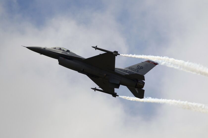 FILE - A Lockheed Martin F-16 Jet fighter performs its demonstration flight, June 22, 2011, at the 49th Paris Air Show at Le Bourget airport, east of Paris. People living in and around Washington D.C. experienced a rare, if startling, sound: A sonic boom. The U.S. military had dispatched a fighter jet on Sunday, June 4, 2023, to intercept an unresponsive business plane that was flying over restricted airspace. The Air Force gave the F-16 permission to fly faster than the speed of sound to catch up with it. (AP Photo/Francois Mori, File)