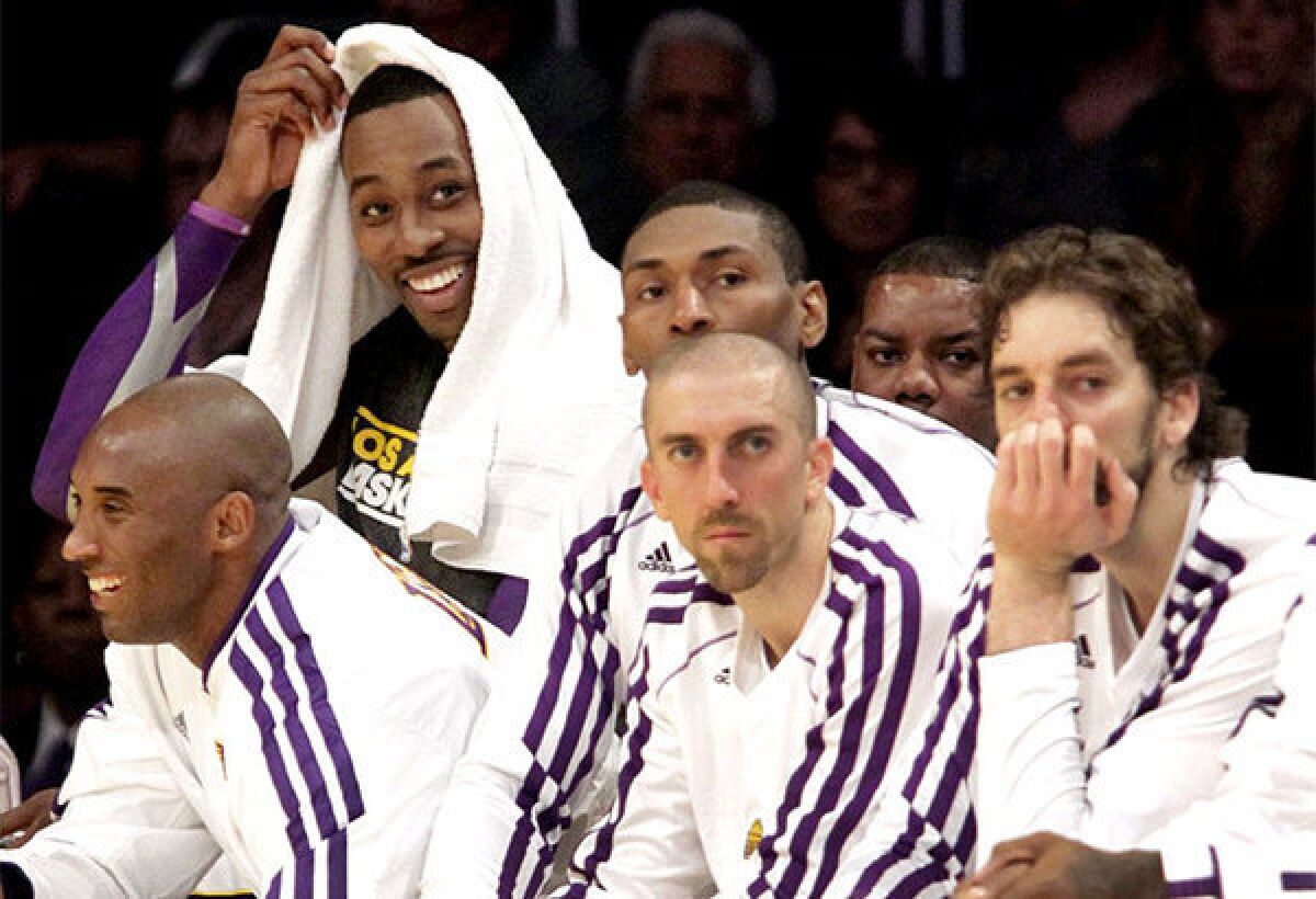The Lakers' Kobe Bryant, left, Metta World Peace, Steve Blake or Pau Gasol could be amnestied. Dwight Howard (background) can sign with the Lakers for five years at $118 million.