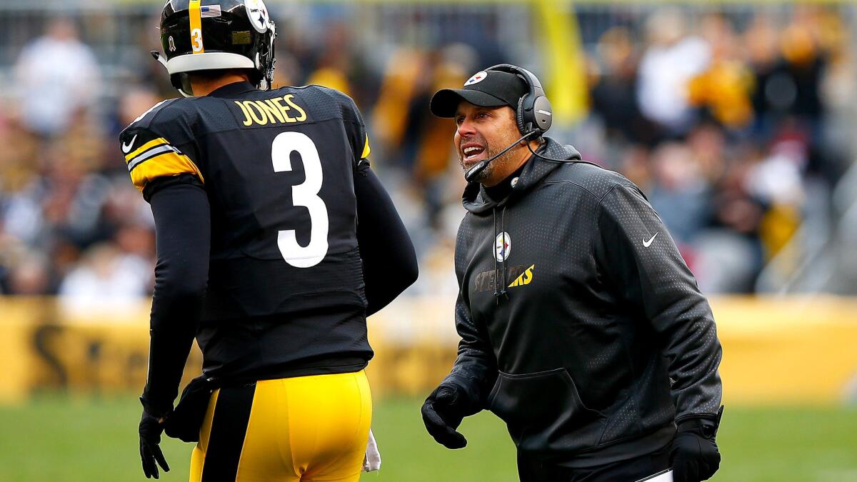 Steelers offensive coordinator Todd Haley gives instruction to third-string quarterback Landry Jones, who was pressed into action last week after injuries to Ben Roethlisberger and Michael Vick.