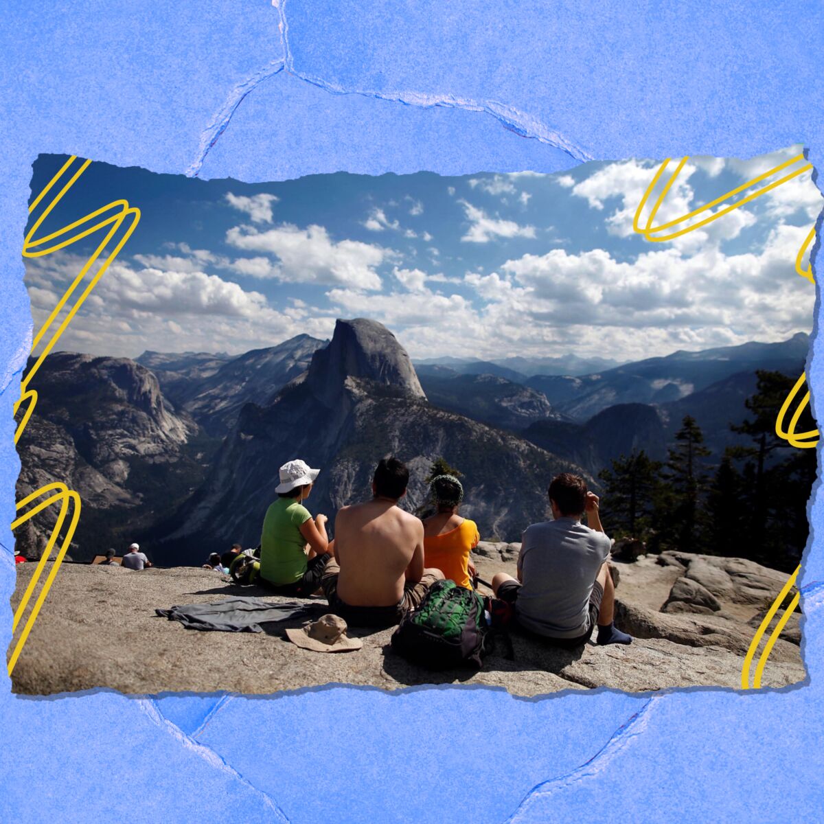 Visitors enjoy the grand view at Glacier Point in Yosemite National Park.