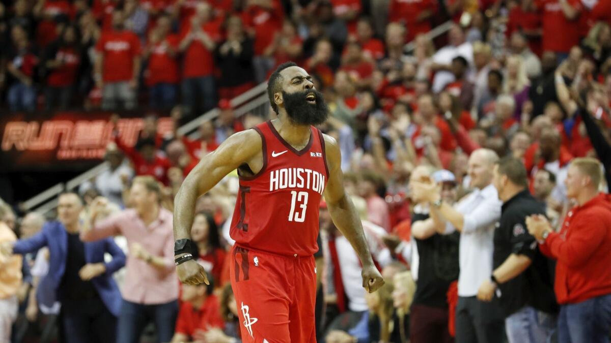 James Harden celebrates the Rockets' victory over the Warriors.