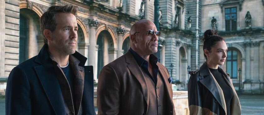 Ryan Reynolds, Dwayne Johnson and Gal Gadot in the movie "Red Notice."