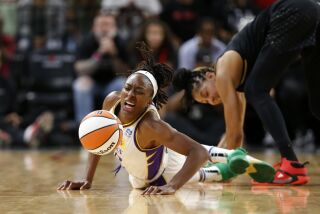 LAS VEGAS, NEVADA - MAY 27: Nneka Ogwumike #30 of the Los Angeles Sparks goes after as loose ball.