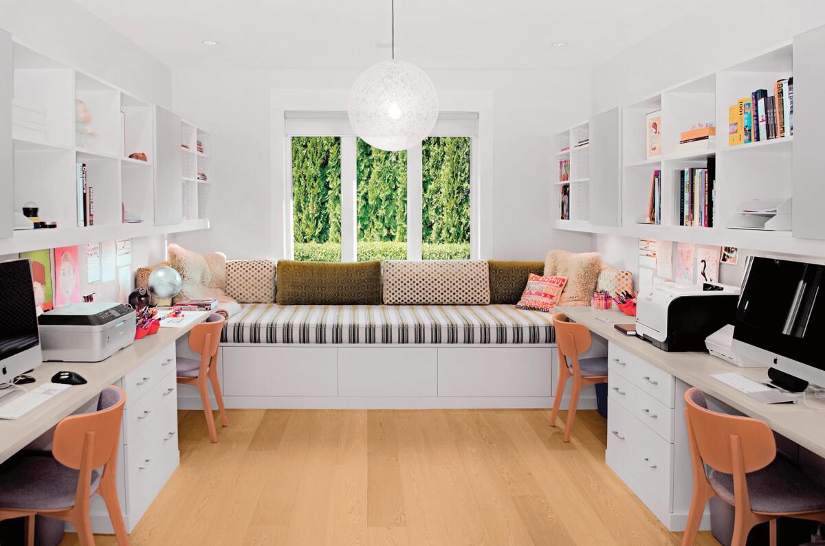 A home-office space design from California Closets includes four workstations for kids and adults and a lounging spot.