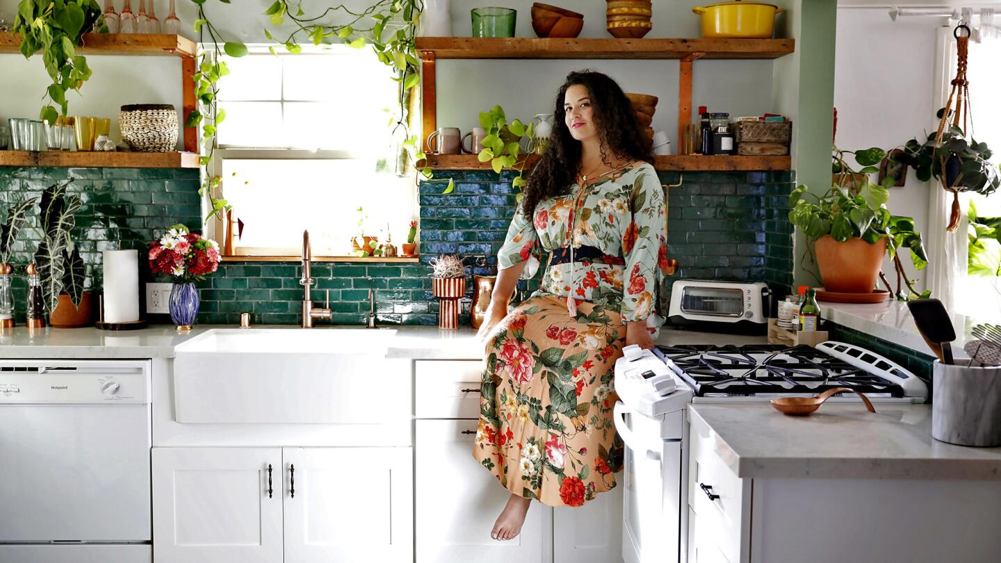 "We’ve got things from Ikea but mix the old and new and handmade, and a couple favorite designer pieces," the designer and the author of “The New Bohemians” says of her kitchen decor.