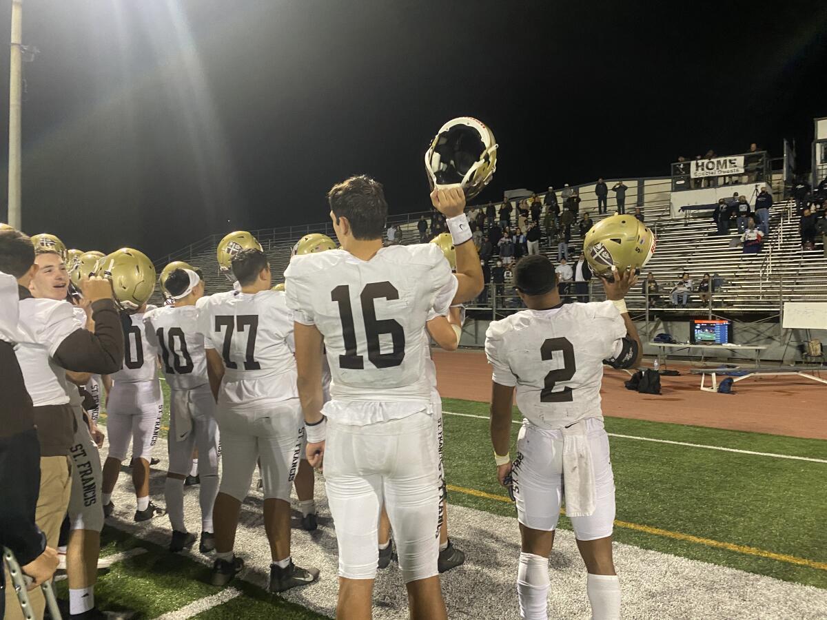 Quarterback Jack Jacobs (16) and running back Max Garrison (2) join teammates in acknowledging their fans.