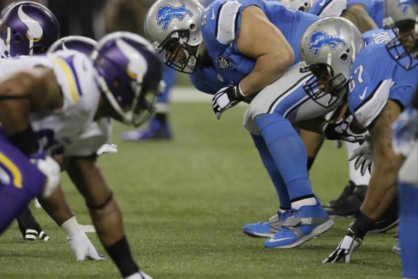 The Detroit Lions have an NFC North division title showdown with the Packers next week, but will they have center Dominic Raiola, pictured snapping the ball?