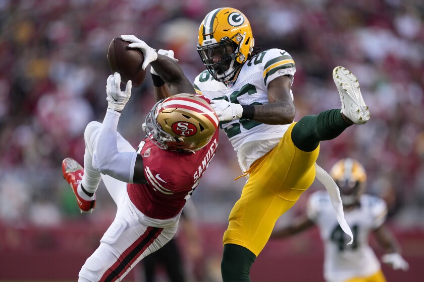 FILE -Green Bay Packers free safety Darnell Savage, right, defends a pass intended for San Francisco 49ers wide receiver Deebo Samuel during the first half of an NFL football game in Santa Clara, Calif., Sunday, Sept. 26, 2021. The Packers and 49er meet Saturday, Jan. 22, 2022. (AP Photo/Tony Avelar, File)