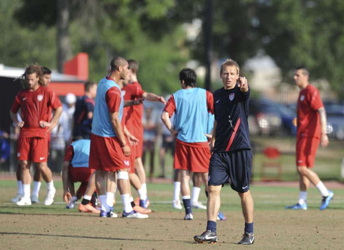 U.S. national team Coach Juergen Klinsmann speaks to his players during a training session last year.