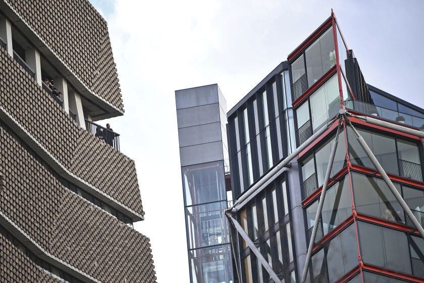 FILE - The Tate Modern viewing platform, left, and residential flats, right, in London, Feb. 2, 2019. The U.K. Supreme Court has ruled Wednesday, Feb. 1, 2023 that a viewing platform at London’s Tate Modern art gallery breached the privacy of residents of luxury apartments next door. The court said the scrutiny made residents feel like animals in a zoo and impeded “the ordinary use and enjoyment” of their homes. (Victoria Jones/PA via AP, file)