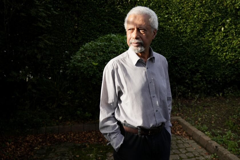 Tanzanian writer Abdulrazak Gurnah poses for a photo at his home in Canterbury, England, Thursday, Oct. 7, 2021. Gurnah was awarded the Nobel Prize for Literature earlier on Thursday. The Swedish Academy said the award was in recognition of his "uncompromising and compassionate penetration of the effects of colonialism." (AP Photo/Frank Augstein)