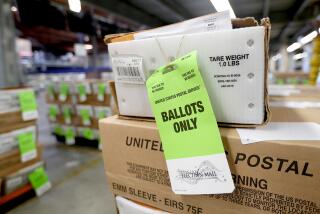 Ballots wait to be processed at the Orange County Registrar of Voters facility in Santa Ana on Wednesday. Ballot materials will be mailed on Monday.