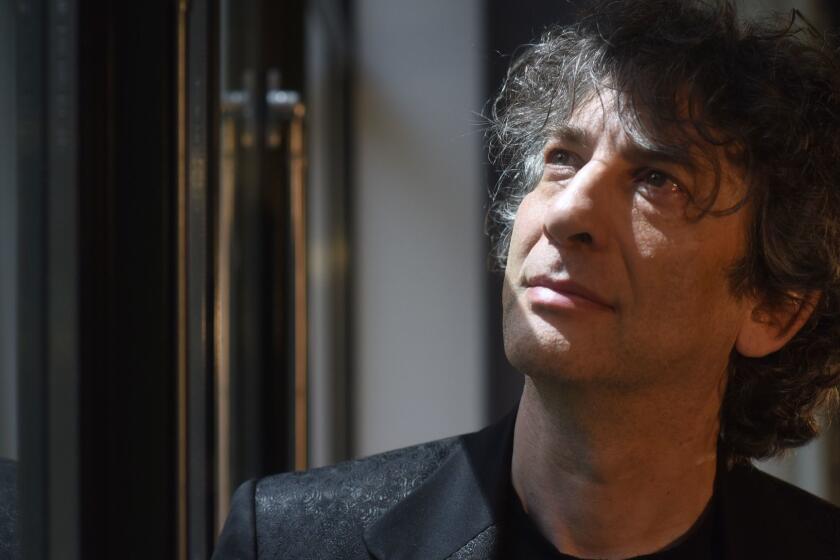 MANHATTAN, NEW YORK, MAY 23, 2019 Neil Gaiman, who created the comedic limited series Good Omens, about the bungling of Armageddon, is seen at The Whitby Hotel in Manhattan, NY. 5/23/2019 Photo by Jennifer S. Altman/For The Times