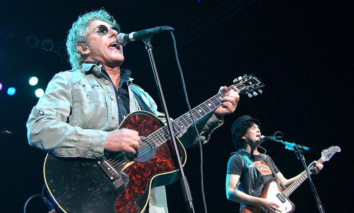 Roger Daltrey, left, and guitarist Frank Simes, open the show with I Can See for Miles at the Pacific Amphitheater show on Saturday.