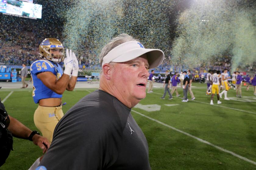 UCLA coach Chip Kelly leaves the field after his Bruins beat LSU 38-27 at the Rose Bowl on Sept. 4, 2021.